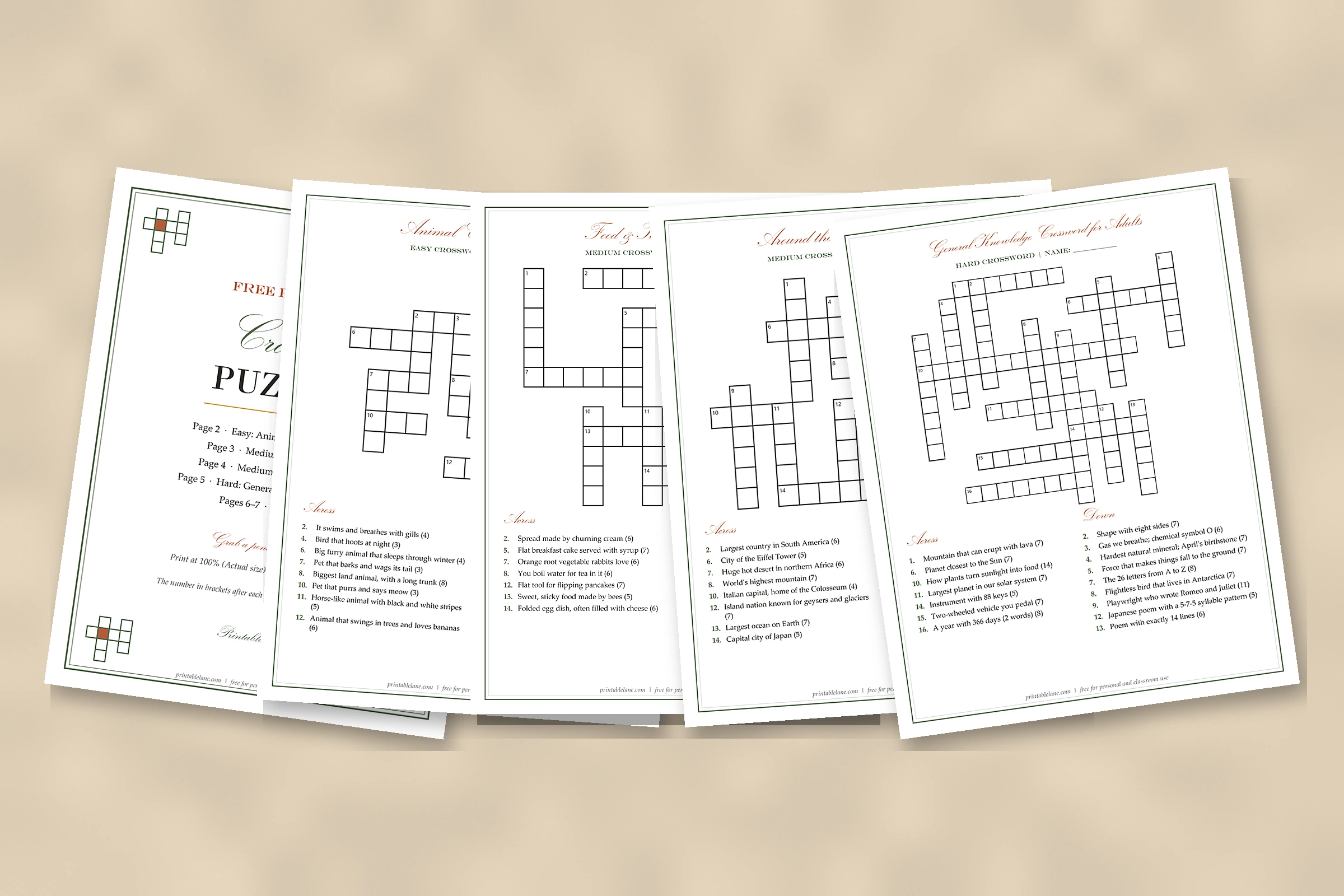 Five pages of free printable crossword puzzles laid out on a table